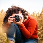 A group of photographers taking photos together in Melbourne, capturing the city skyline at sunset. They are smiling, engaged in conversation, and enjoying the camaraderie of being part of a photography club.